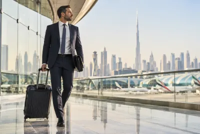 Business traveller with luggage at the airport in Dubai